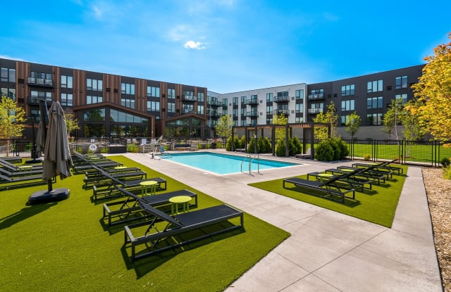 The Bowline at Mississippi Crossings — modern apartments with a courtyard pool and green space