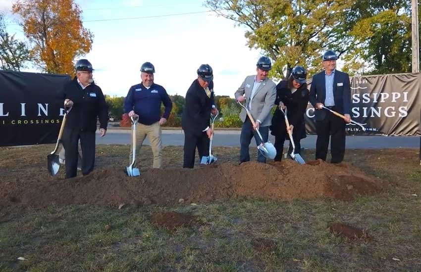 Ground-breaking ceremony for Mississippi Crossings with Mayor Ryan Sabas and community leaders in hard hats with shovels