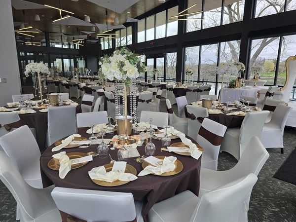 Banquet hall set with tables for an event inside the Mississippi Crossings Event Center