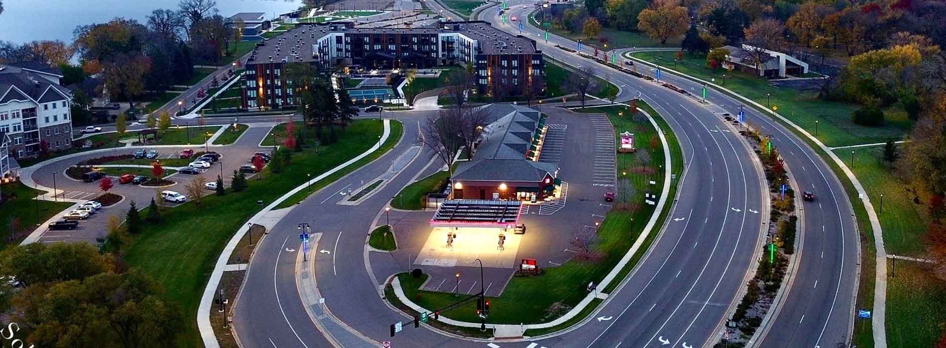 Aerial view of the HWY 169 interchange and Mississippi Crossings development in Champlin at dusk