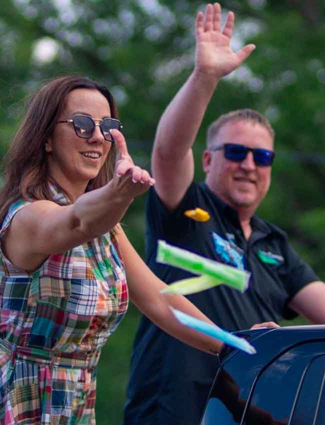 Ryan Sabas and his wife greeting residents at a Champlin community parade